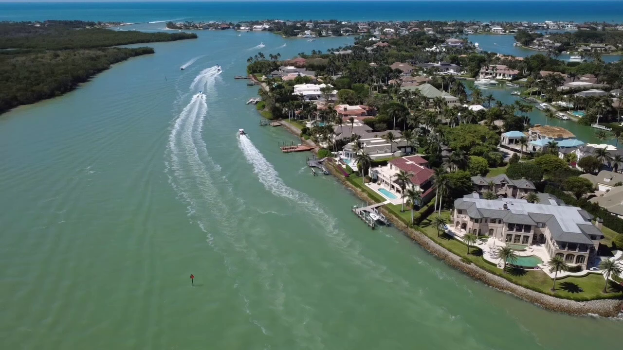 Aerial view of a pontoon boat cruising near Marco Island, Florida